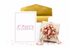 Gift box with pink ribbon, gold envelope, and 'LET'S CELEBRATE' card on a white background